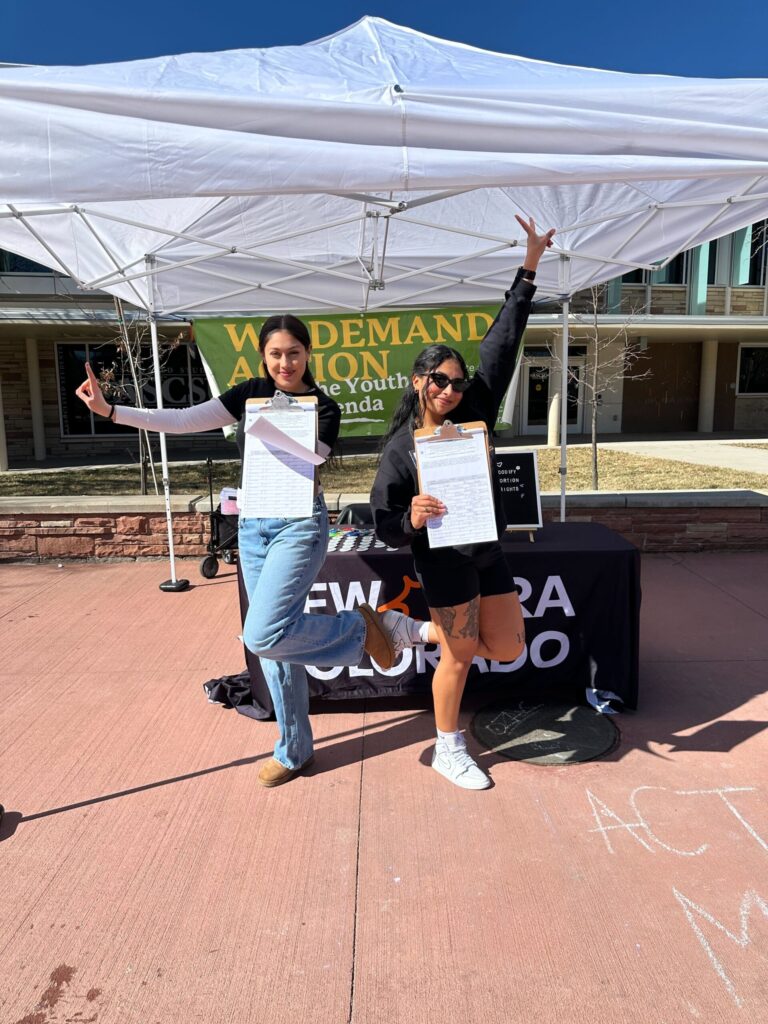 Northern Regional Lead Organizer Kimberly Carracedo hosts a table with the Northern intern, Alejandra, in Feb. 2024.