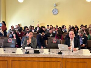 Regional Lead Organizer Kimberly Carracedo testifies on behalf of New Era Colorado during a committee hearing.